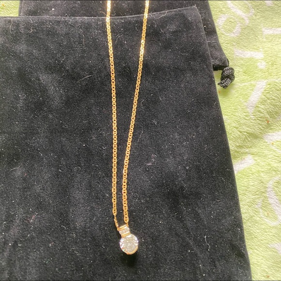 14kt yellow gold necklace and white sapphire penda